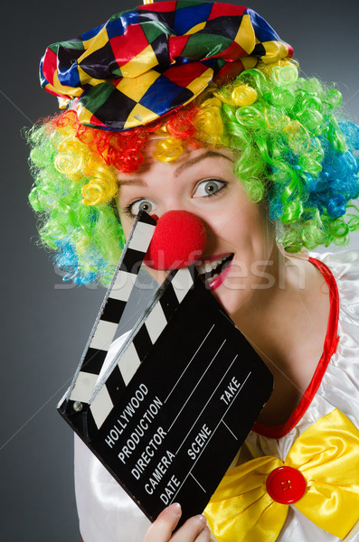 Clown with movie clapper in funny concept Stock photo © Elnur