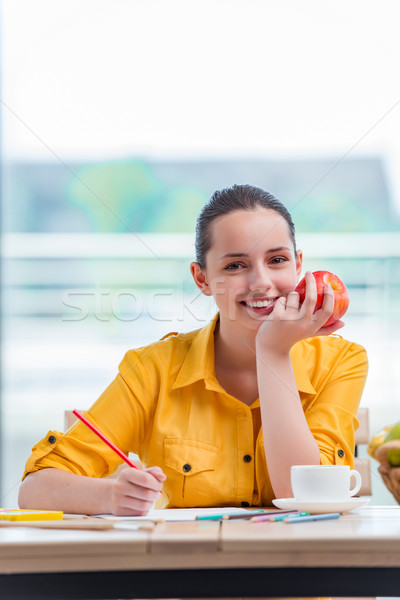 Young school gilr drawing pictures at home Stock photo © Elnur