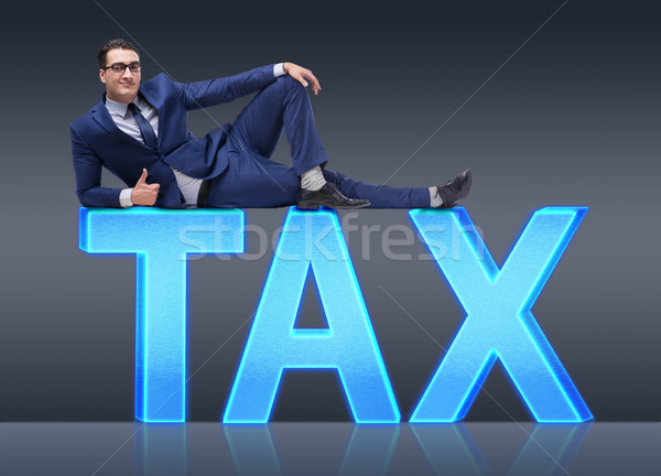 Businessman in tax burden business concept Stock photo © Elnur