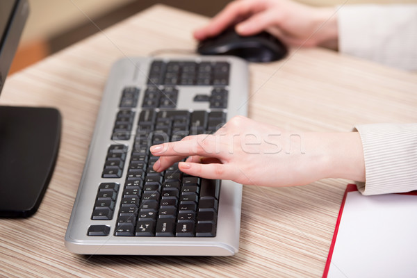 Hands working on the keyboard in the office Stock photo © Elnur
