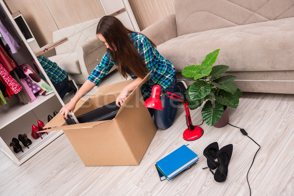 Young woman packing personal belongings Stock photo © Elnur