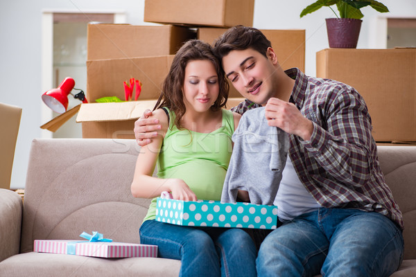 Young couple of man and pregnant wife with giftbox Stock photo © Elnur