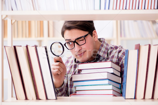 [[stock_photo]]: Jeunes · étudiant · regarder · livres · collège · bibliothèque