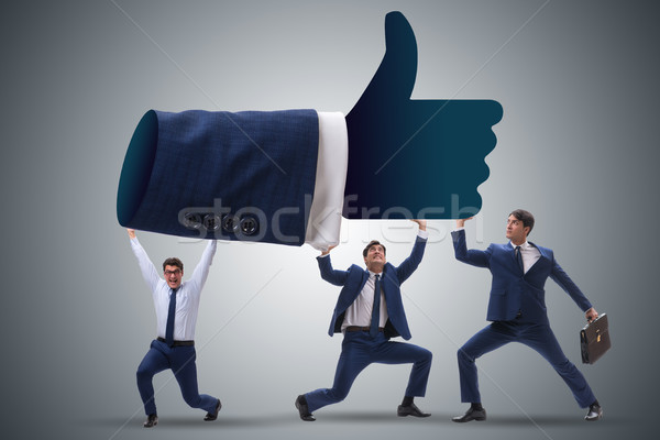Businessmen supporting thumbs up gesture Stock photo © Elnur