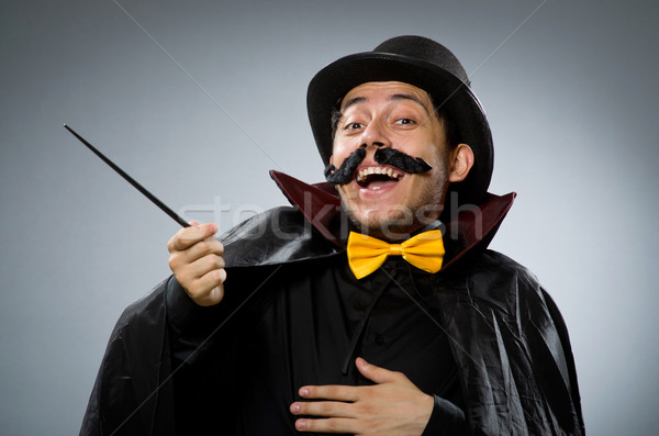 Funny magician man with wand and hat Stock photo © Elnur