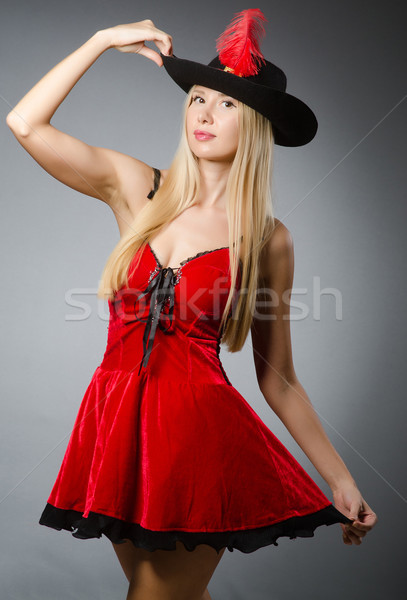 Młoda kobieta czerwony mini sukienka hat szary Zdjęcia stock © Elnur