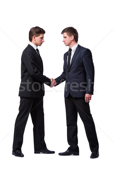 Two twin brothers handshaking isolated on white Stock photo © Elnur