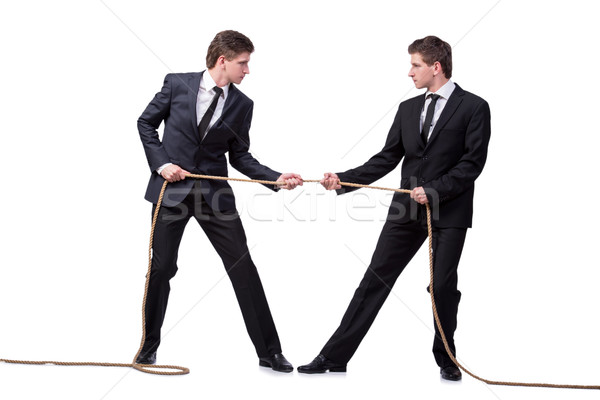 Stock photo: Twin brothers in tug of war concept isolated on white