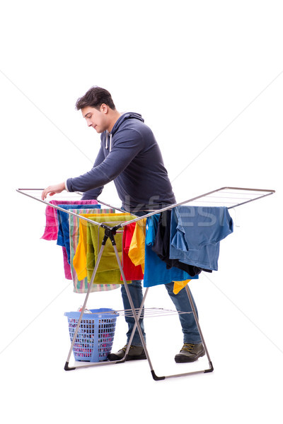 The husband man doing laundry isolated on white Stock photo © Elnur