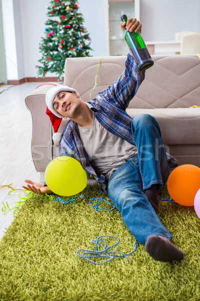 Stock photo: Man having hangover after christmas party