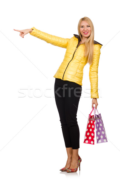 Caucasian woman in yellow jacket holding plastic bags isolated o Stock photo © Elnur