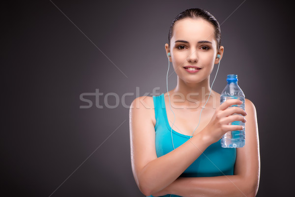 Mulher esportes garrafa água doce água música Foto stock © Elnur