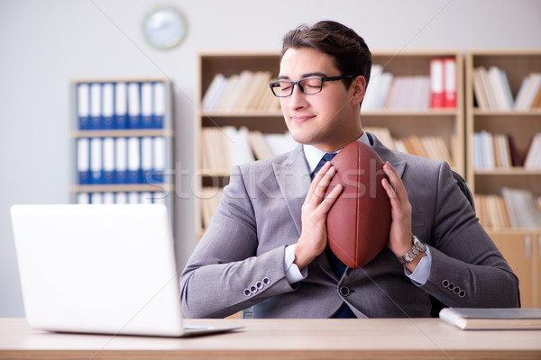 The businessman with american football in office Stock photo © Elnur