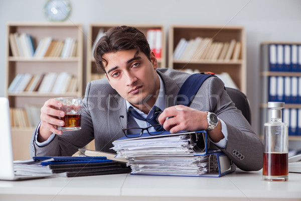 Stock photo: Businessman drinking in the office