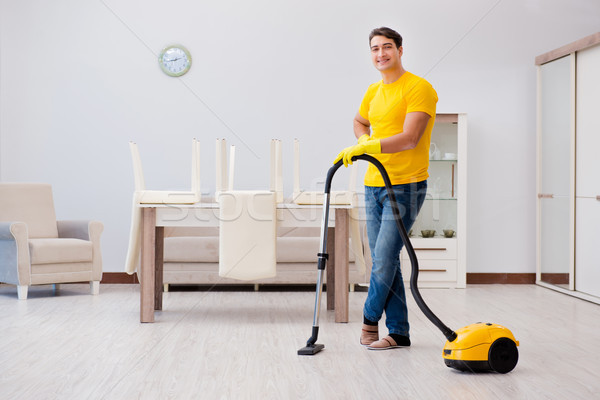 Man husband cleaning the house helping his wife Stock photo © Elnur