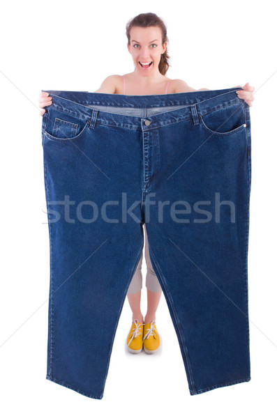 Woman in dieting concept with big jeans Stock photo © Elnur