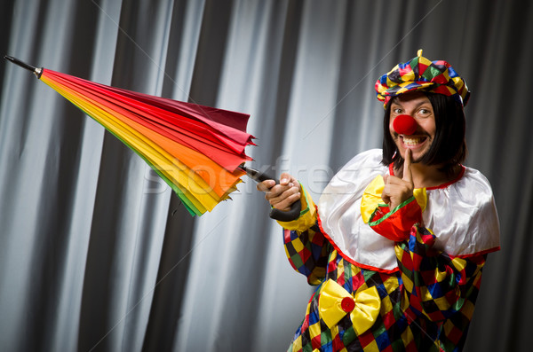 Funny clown with colourful umbrella  Stock photo © Elnur