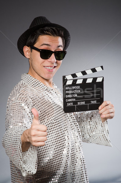 Young camera assistant with clapperboard Stock photo © Elnur