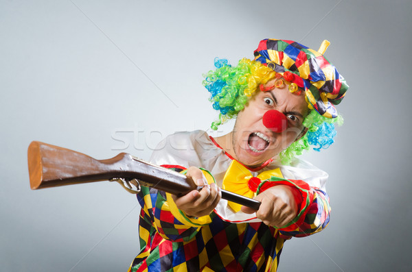 Clown with rifle isolated on white Stock photo © Elnur