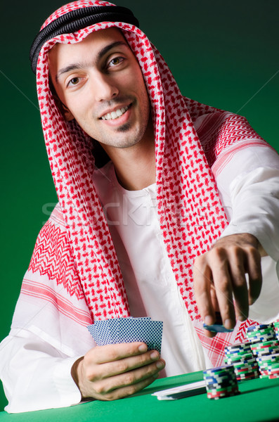 Stok fotoğraf: Arap · adam · oynama · kumarhane · yeşil · takım · elbise