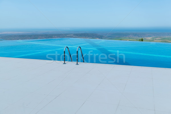 Infinito piscina brilhante verão dia céu Foto stock © Elnur