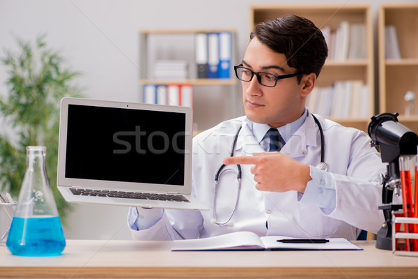 Young adult doctor with laptop computer Stock photo © Elnur