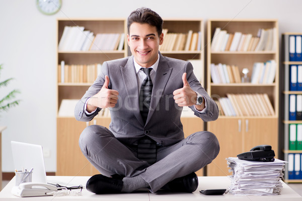 Jovem empresário meditando escritório fundo terno Foto stock © Elnur