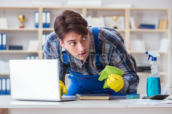 Stock photo: Hacker under cleaner cover stealing personal data