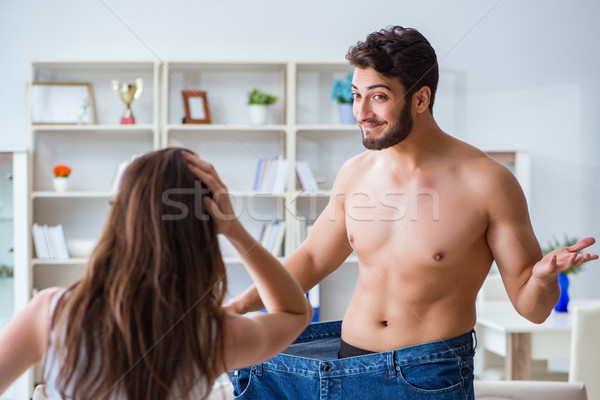 Férfi túlméretezett nadrág fogyókúra barátnő feleség Stock fotó © Elnur