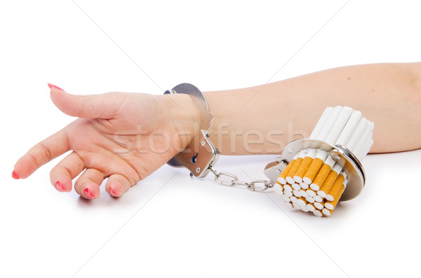 Addition concept with cigarettes and handcuffs Stock photo © Elnur