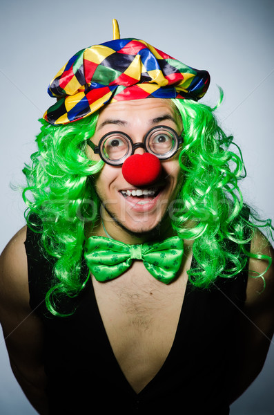 Funny clown against the dark background Stock photo © Elnur