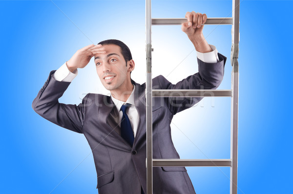 Businessman climbing the ladder isolated on white Stock photo © Elnur