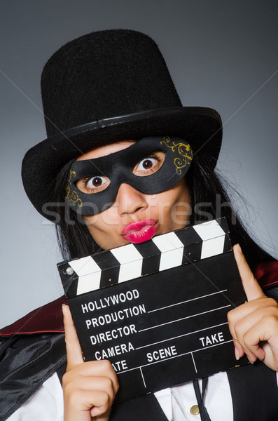 ストックフォト: 女性 · 着用 · マスク · 映画 · ボード · 芸術