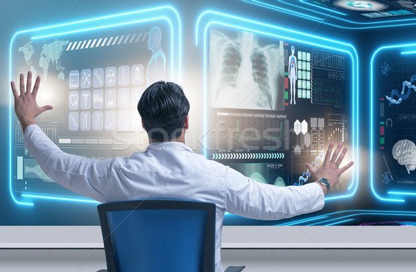 Male doctor in futuristic medical concept Stock photo © Elnur