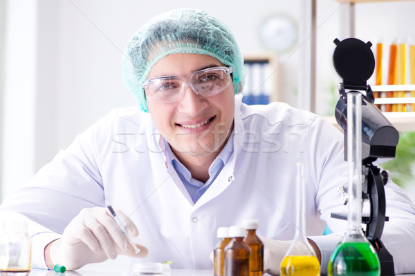 Pharmaceutical industry concept with scientist in the lab Stock photo © Elnur