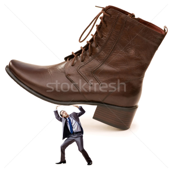 Woman domination concept with shoes and man Stock photo © Elnur