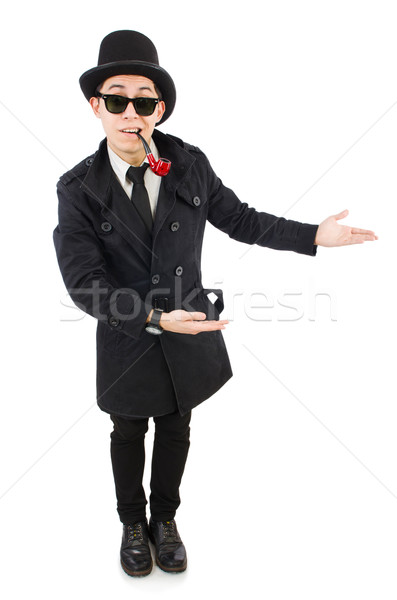 Young detective in black coat holding magnifying glass isolated  Stock photo © Elnur