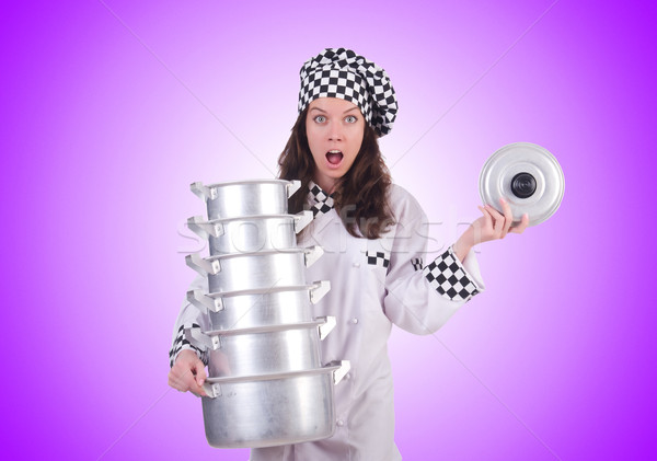 Cook with stack of pots on white Stock photo © Elnur