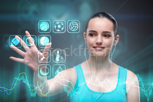 The young girl in sports concept pressing virtual buttons Stock photo © Elnur