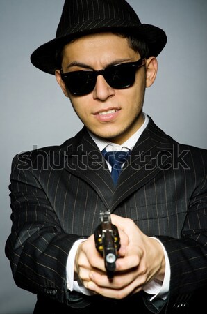 Mann tragen Sonnenbrillen gun Hand funny Stock foto © Elnur