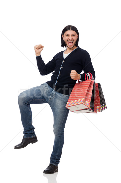 Young man holding plastic bags isolated on white Stock photo © Elnur