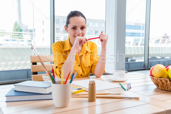 Young school gilr drawing pictures at home Stock photo © Elnur