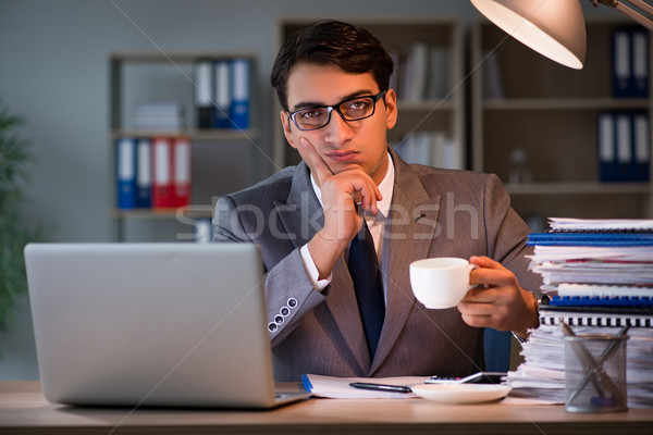The businessman staying in the office for long hours Stock photo © Elnur