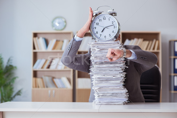 Businessman busy with paperwork in office Stock photo © Elnur