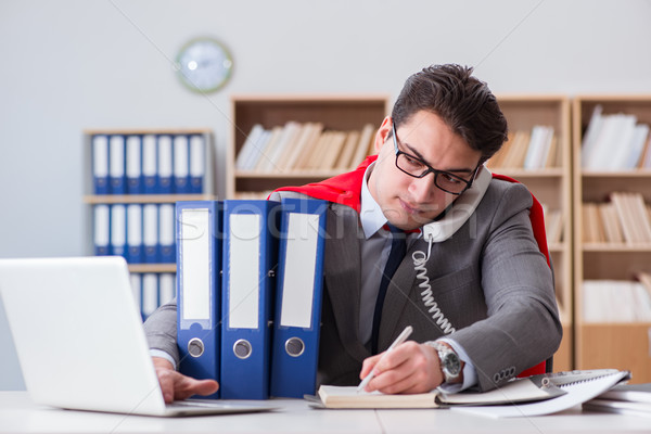 Superhero businessman working in the office Stock photo © Elnur