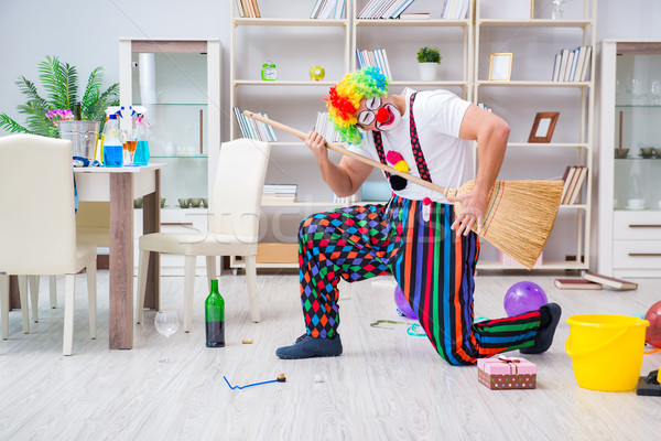 Funny clown doing cleaning at home Stock photo © Elnur