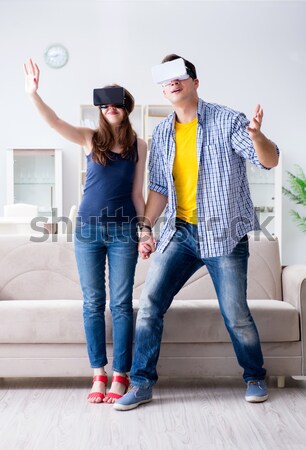 Stock photo: The armed man assaulting young woman at home
