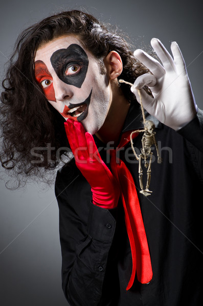 Funny man with skeleton in hands Stock photo © Elnur