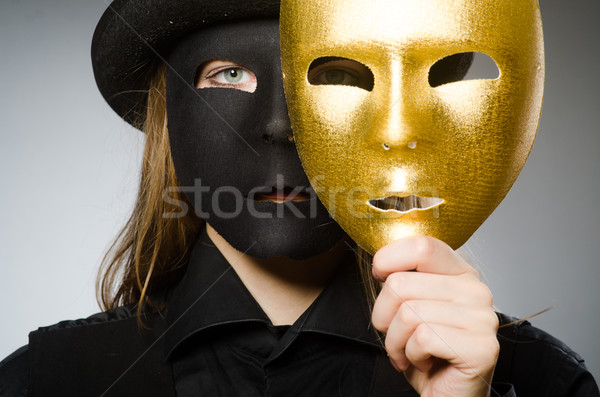 Woman with mask in funny concept Stock photo © Elnur