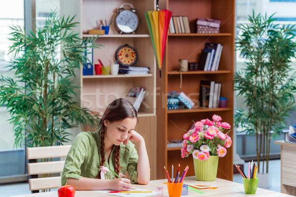 Young girl drawing pictures at home Stock photo © Elnur